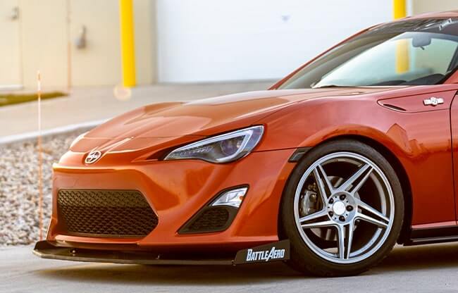 Orange 2013 Scion FR-S with Brushed Apollo Silver Anovia Carrier Wheels